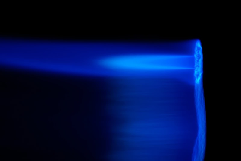 Close up photo of a blue flame.